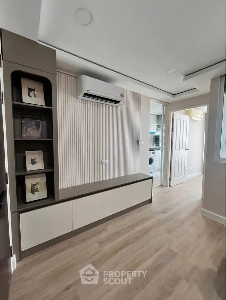 Modern apartment interior with air conditioning and wooden flooring