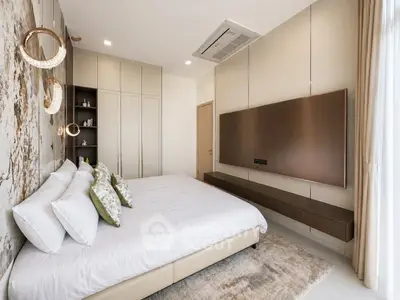 Luxurious modern bedroom with elegant decor and ample natural light