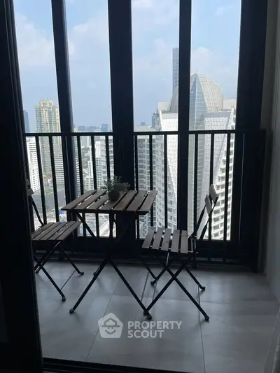 Chic urban balcony with stunning cityscape view, perfect for relaxation and enjoying the skyline.