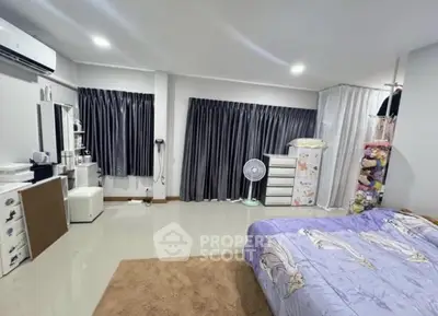 Spacious bedroom with modern decor and ample storage space