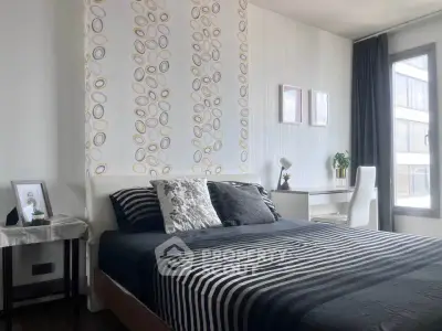 Modern bedroom with stylish decor and natural light in urban apartment
