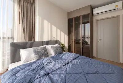 Modern bedroom with stylish decor and ample natural light