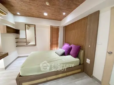 Modern bedroom with stylish wooden accents and cozy lighting