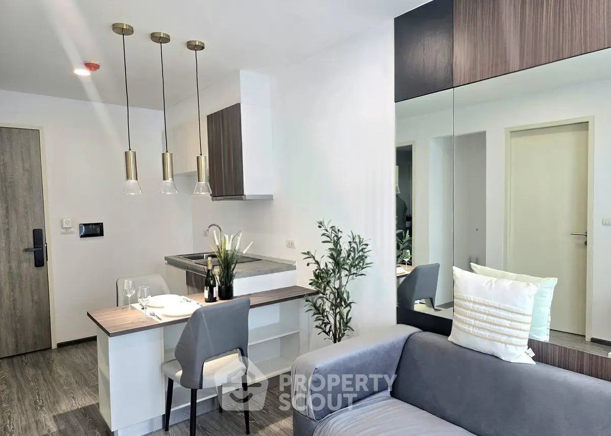 Modern open-plan living room with stylish kitchen and elegant decor