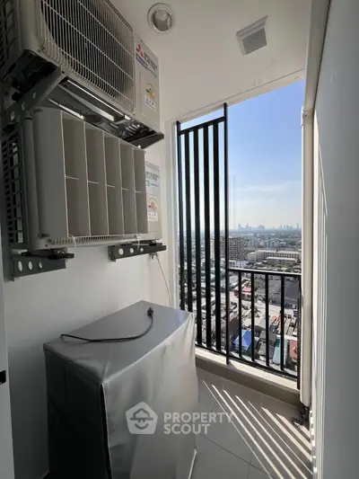 High-rise apartment balcony with city view and air conditioning units.