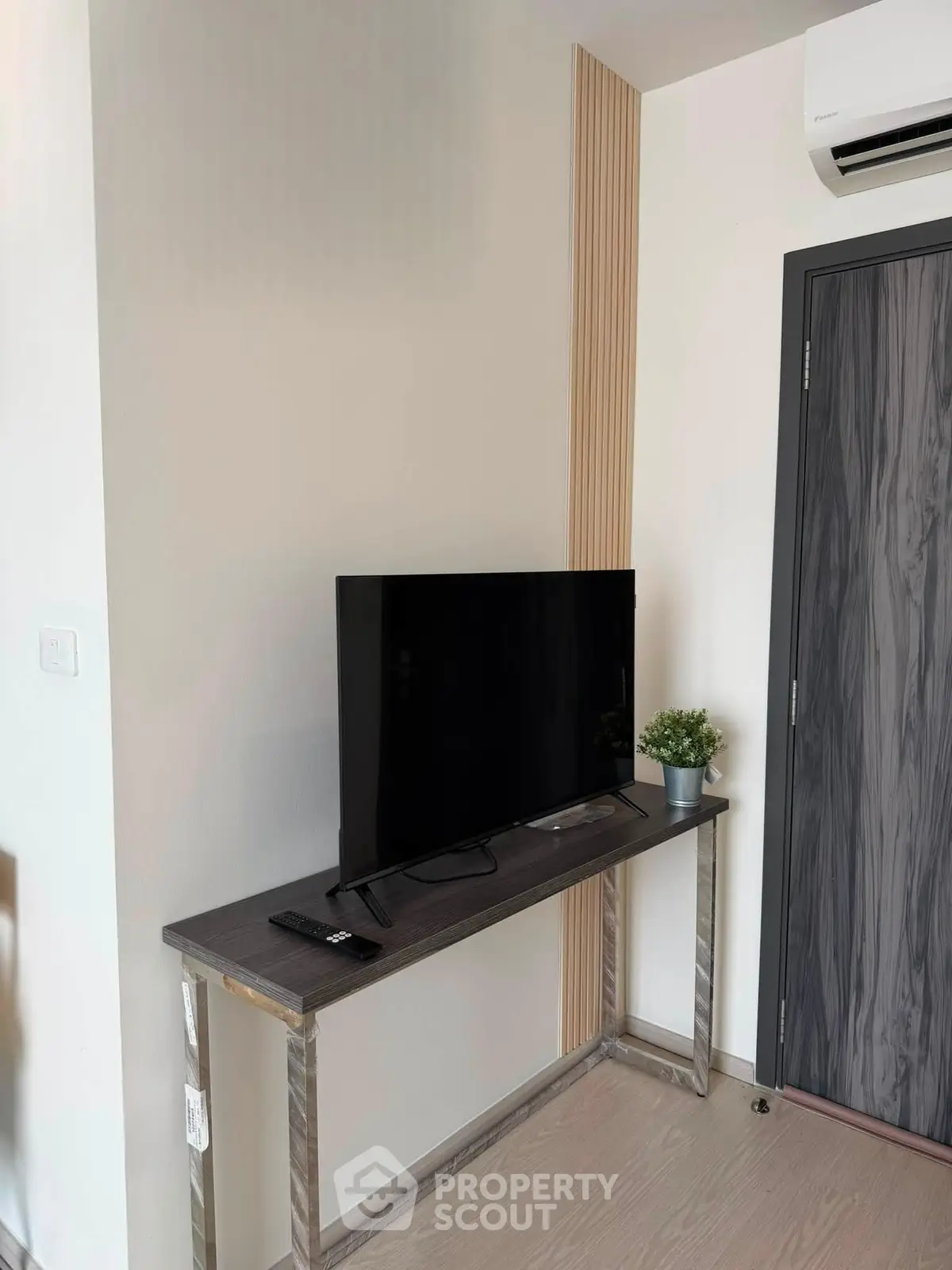 Modern living room corner with sleek TV setup and stylish decor