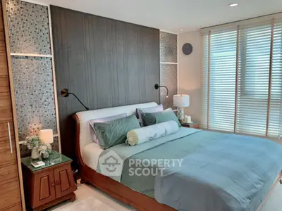 Luxurious bedroom with modern decor and natural light