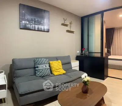 Modern living room with stylish decor and cozy ambiance in a contemporary apartment.