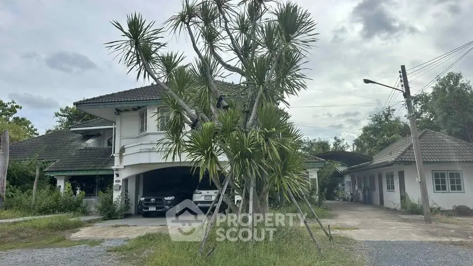 Charming suburban home with lush greenery and spacious driveway, perfect for family living.