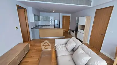 Spacious modern living room with open kitchen and stylish furnishings