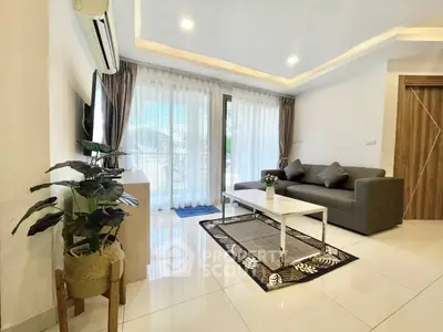 Modern living room with sleek design, large windows, and stylish furniture.