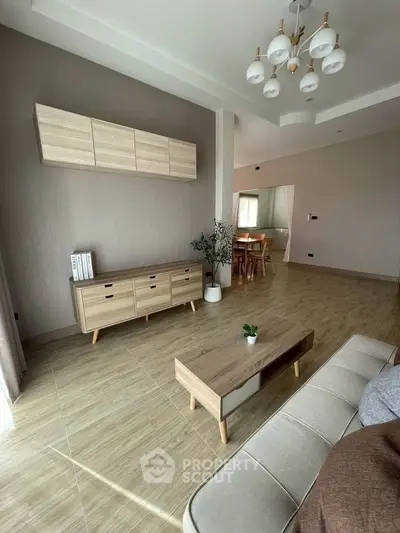 Spacious modern living room with elegant wooden furniture and natural light