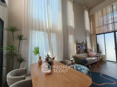 Spacious living room with high ceilings and elegant decor