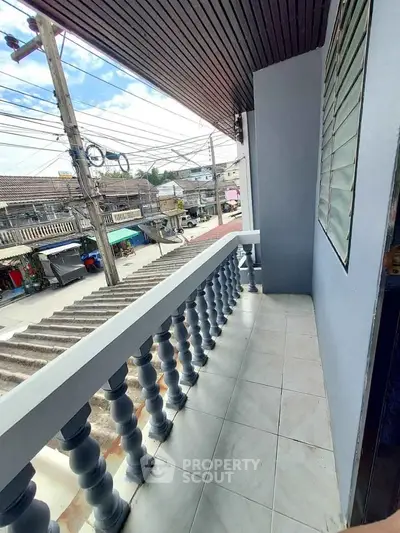 Charming balcony with city view, perfect for relaxation and enjoying urban scenery.