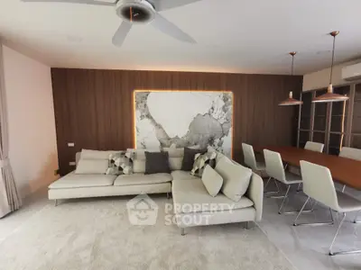 Modern living room with stylish sofa and elegant dining area