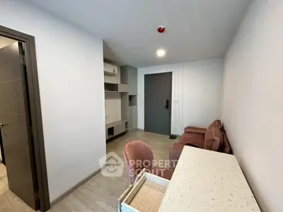 Modern living room with stylish furniture and neutral tones, perfect for a cozy urban lifestyle.