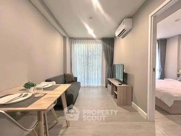 Modern living room with cozy dining area and natural light