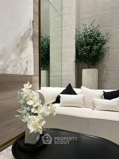 Elegant modern living room with stylish decor and lush indoor plant