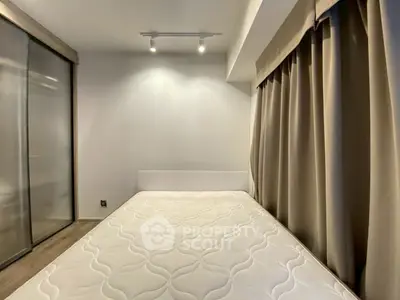 Modern bedroom with minimalist design and large window curtains