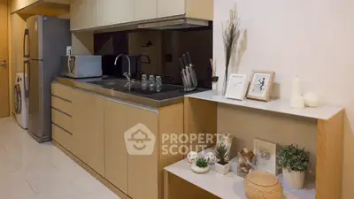 Modern kitchen with sleek cabinetry and appliances in a stylish apartment.
