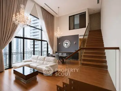 Luxurious modern living room with high ceilings, elegant chandeliers, and large windows offering city views.