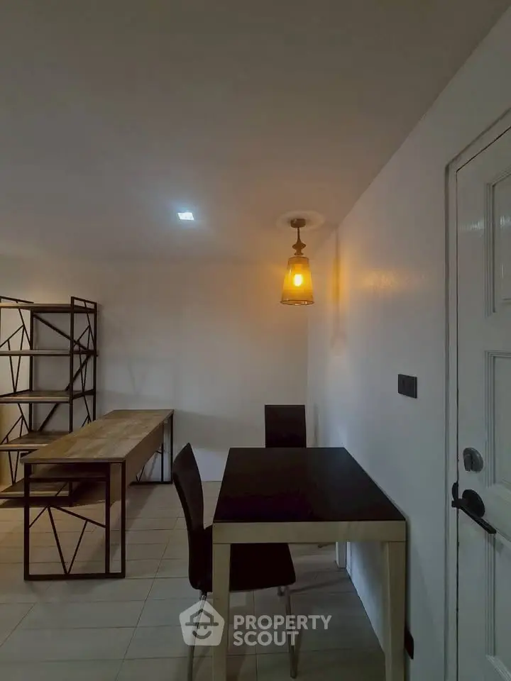 Modern minimalist interior with sleek furniture and ambient lighting, perfect for a stylish workspace or dining area.