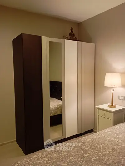 Elegant bedroom with stylish wardrobe and cozy lighting