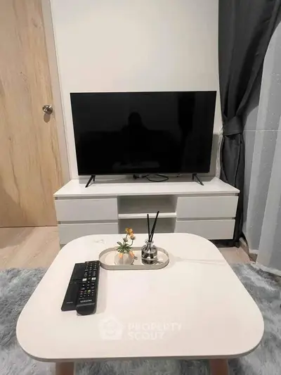 Modern living room with sleek TV setup and stylish decor