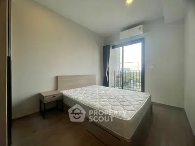 Modern bedroom with balcony access and natural light