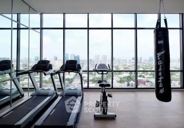 Luxury gym with panoramic city view and modern equipment