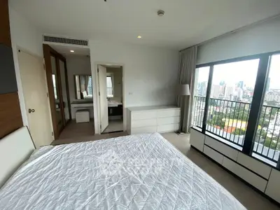 Spacious bedroom with city view and modern furnishings