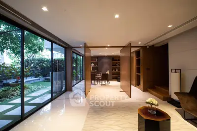 Luxurious modern living room with garden view and elegant decor