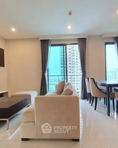 Spacious modern living room with city view and elegant furnishings