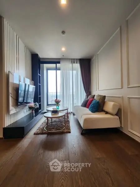 Stylish modern living room with elegant decor and balcony view