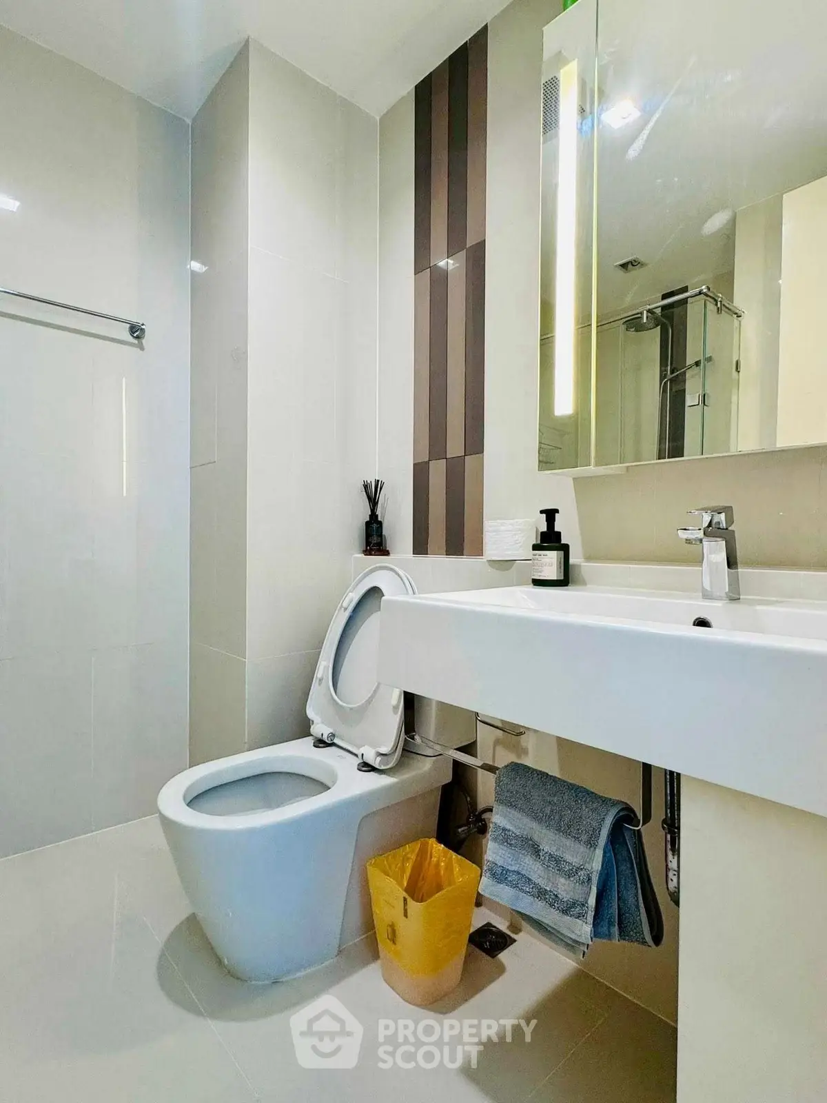Modern bathroom with sleek fixtures and contemporary design in a real estate property.