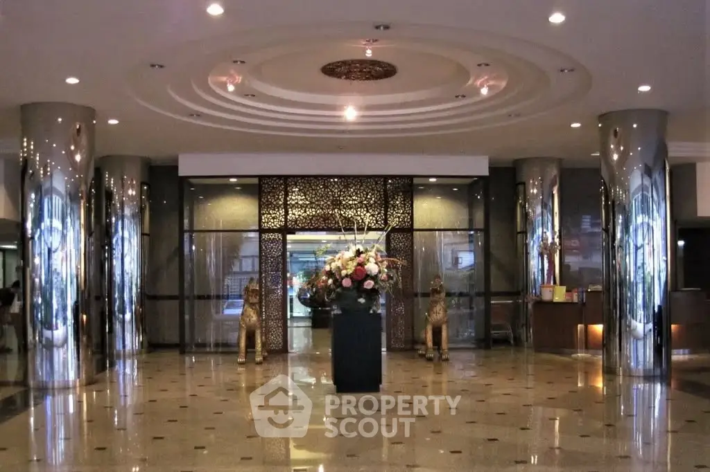 Luxurious building entrance with elegant decor and polished marble flooring