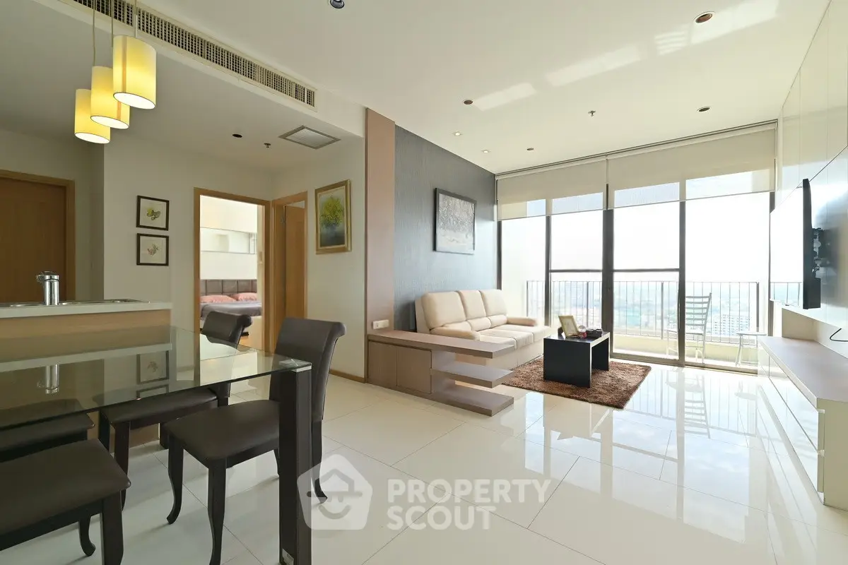 Spacious modern living room with large windows and elegant decor