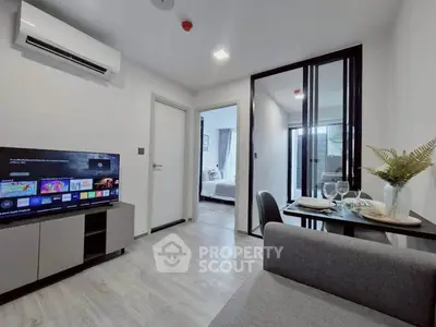 Modern living room with sleek design, open layout, and stylish decor in a contemporary apartment.