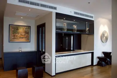 Modern interior with stylish decor and open layout, featuring elegant artwork and sleek furniture.
