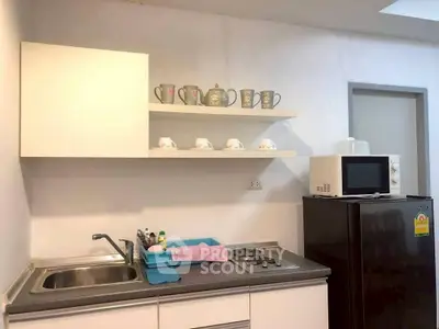 Modern kitchen with sleek appliances and open shelving