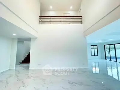 Spacious modern living room with high ceilings and elegant marble flooring