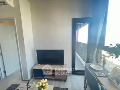 Modern living room with balcony access and stylish decor