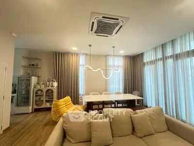 Modern living room with stylish lighting and cozy seating area