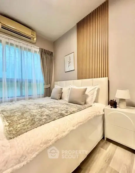 Cozy modern bedroom with elegant decor and natural light