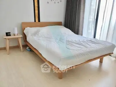 Modern bedroom with minimalist wooden bed and natural light