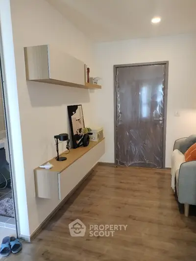 Modern hallway with wooden flooring and stylish wall-mounted shelves