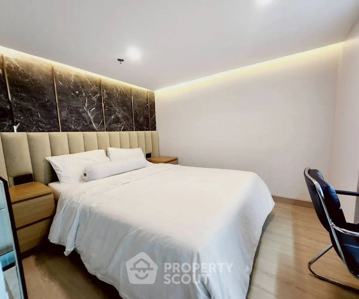 Luxurious modern bedroom with elegant decor and ambient lighting