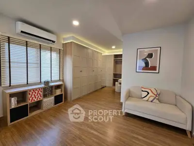 Spacious modern living room with wooden flooring and stylish decor