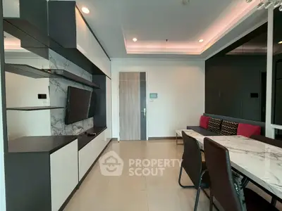 Modern living room with sleek furniture and marble accents in a stylish apartment.