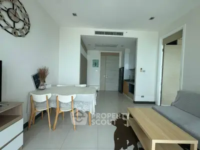 Modern living room with dining area and minimalist decor in a bright apartment.